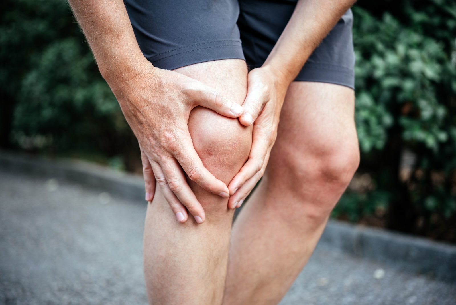 Meniscus tear in man athlete’s knee, sports injuries concept meniscus tear at denver pt